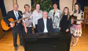 The newly formed Derryvolgie Singers pictured at the '
Festival of Nine Lessons and Carols'
 in St Columba'
s, Derryvolgie last Sunday evening (16th December). L to R: Jim Hamilton, Liz Spence, Thelma Campbell, Karen McIvor, Emma-Louise Spence, Lindsay Hamilton and Graham Murphy (seated at keyboard).
