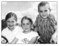 On a tractor at the Harry Ferguson Celebration Committee Show at Growell are Hannah Jess, Chloe Stewart and Aaron Stewart. BL34-414SM 