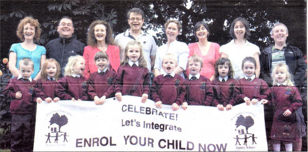 The new Principal, Frances Hughes (third from left), parents and children celebrate the opening of Rowandale Integrated Primary.