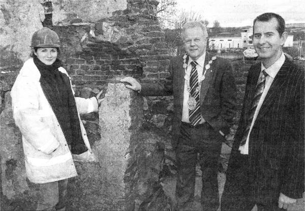 Chairman of the Council's Economic Development Committee, Alderman Edwin Poets and Mayor Councillor Trevor Lunn receive a tour of the latest 'archaeological finds' at Castle Gardens with Stephanie McMullen of Archaeology Development Services.