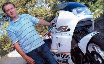 Proud owner Brian Mulholland standing next to Joey Dunlop's only Production 750 winning bike. US1907-350DW