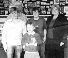 Lillie Jackson with her parents, aunt Sarah Wilson and the Chief Executive of the SEELB Irene Knox at Charley Memorial Primary School