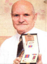 Phil Price, Secretary National Malayan and Borneo Veterans Association (Ireland Branch) with his medal he received at the prestigious ceremony hosted by Lisburn City Council.