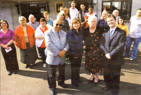 South African guest Professor Kader Asmal, Fiona McCausland from the Old Warren Partnership, Maggie Beirne from CAJ with Lagan Valley MP Jeffrey Donaldson and members of the Old Warren Partnership during Mr Asmal's visit to the Area. US4007-50800