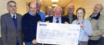 Aidan Lavery (Chairman of Lisburn and District Angling Club) with a cheque for Action Cancer presented to Eddie Bell and Eva Dobson with members of the club US4708-405PM