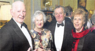 From left to right are: David and Heather Kingan from Hillsborough, David Smith and Mayo Walters enjoy refreshments during a reception at the fundraising concert.