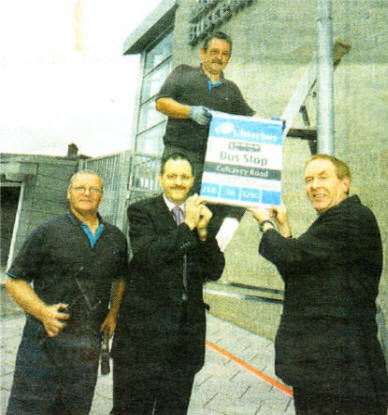 Erecting the bus stop signs at the new Buscentre are from left: George Weir, maintenance; Jim McCauley, Depot Controller; Paddy Arthurs, Maintenance and Michael Stewart, Lisburn Inspector