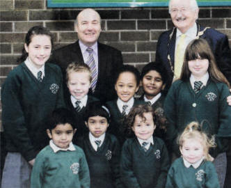 Lisburn Mayor, Councillor Ronnie Crawford meets Principal Mr Patsy McClean and pupils during his recent visit to St. Aloysius Primary School.