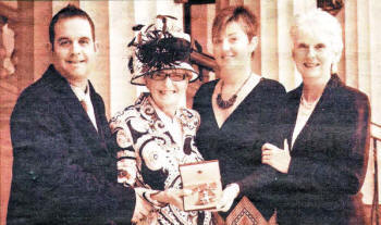 Dr Helen Kirkpatrick with her son Andrew Fullerton, her daughter Kay Magill and her sister Joan Sargent as she collected her MBE at Buckingham Palace.