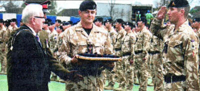 Councillor Allen Ewart, Mayor of Lisburn giving the Operational Service Medal (OSM) for Afghanistan to Major Dave Walker of 49 Battery, 40 Regt the Royal Regiment of Artillery (the Lowland Gunners)