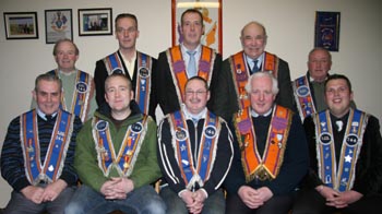  L to R (seated) WBro Harry Shortt PM (Secretary), Bro Robert Hanna (Deputy Master), Bro Rodney Turkington (Worshipful Master), WBro Francis Hughes PM (Treasurer) and Bro Andrew Ewing (Chaplin).  (back row) Bro Charlie Campbell (Assistant Chaplain), Bro Raymond Finn (Second Committee), WBro Alan Finn PM WDM (First Committee), WBro Robert Davis PDM (Third Committee) and Bro Harry Riddle (Fourth Committee).