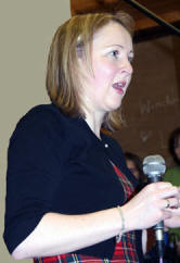 Roberta Ferguson, Chairperson of the Waringsford and Tullyniskey Rural Community Development Association, welcomes a capacity audience to a Burns Night.