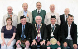 L to R: (front row) Councillor Jennifer Palmer, Fred Walker (RSPBA Northern Ireland Branch President), Councillor Allan Ewart (Lisburn Mayor), Con O’Conaill (Irish Pipe Band Association President) and Edwin Poots (Environment Minister). (back row) Alderman Cecil Calvert, Councillor Peter O’Hagan, George Ussher (RSPBA President), Alderman Ivan Davis OBE and Ernie Clarke (RSPBA). 