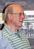 Appropriately against the backdrop of a large poster of Hilden Mill, former mill worker Eric Scott is questioned about his experiences at the world famous linen thread works as Noel introduces his new song entitled ‘Barbour Mill’ which recalls that 2000 employees walked, cycled and came by bus and train answering the call of the ‘Barbour Mill’ horn. 