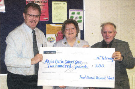 Alderman Cecil Calvert, Lagan Valley Traditional Unionist Voice branch Chairman, and Treasurer Mr William Mitchell recently presented a cheque on behalf of the officers and members of the branch to Mrs Sandra Macauley of Marie Curie Cancer Care