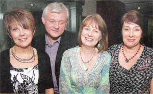 Rosie and Dale Orr, Joan Roddis and Alison Metcalfe at the Dunmurry High School reunion in the Beechlawn Hotel. US1909-524cd 