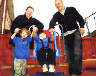 Gary Keatings with his family (1-RI sister, Rachel Keatings, Paula McManus and Robert Keatings, receives a play park courtesy of Make-A-Wish Foundation UK.