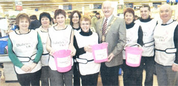 At the marathon bagpacking at Tesco s nominated charity Diabetes e (I-r) Avril Hughes, Elizabeth Ferguson, Nichola Prentice, Carol Hamilton, Jane Black, Lisburn City Council Mayor, Councillor Ronnie Crawford, Sharon Patterson, Shaun McGurnaghan and Alderman Ivan Davis.