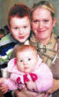 Julie Beattie (Former Anchor Boys' leader) with her son Cameron and daughter Lillie at the 'Centenary Sale'.