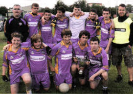 Winners of the Colin Cup, St Pat's GAC Lisburn, along with team mentors Chris O'Neill and John O'Doherty.