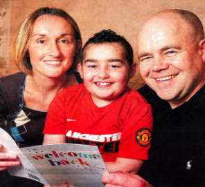 Julie and Joe Fletcher, Moira, with their son Joshua, 8, who has returned home after spending eight months in London for a bone marrow transplant. US401O-516cd