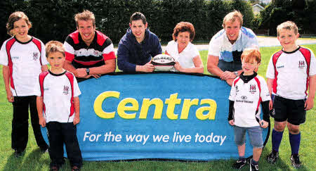 Local children who took part in the Lisburn RFC summer camp are pictured with Ulster Rugby players Ti Anderson (rear left) and Stephen Ferris (rear right). Mark McDermott, Centra Lisburn and Karen McCammond, Centra Moira (centre) were on hand to represent camp sponsor Centra.