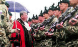 Lisburn City Mayor Paul Porter inspects the parade.