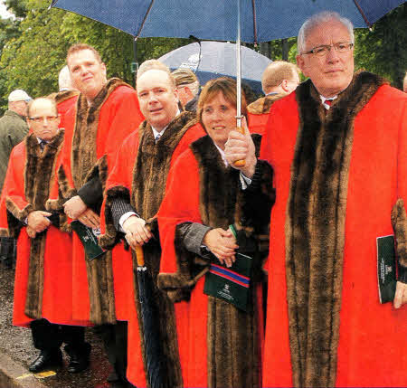 Lisburn councillors watch as the Royal Irish Regiment parade passes the war memorial. US2111-582cd