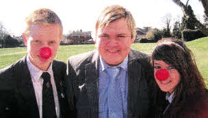 Aaron with GCSE Journalism pupils Adam McKendry and Alanna Terrington who were on hand to document his big day.