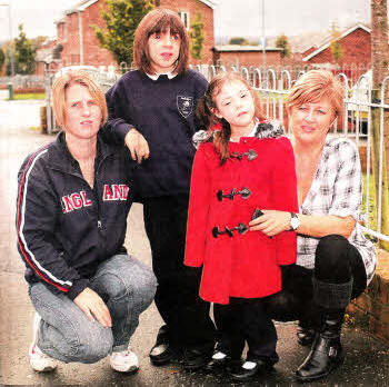 Lindsay Myer and daughter Chloe and Heather Donaghy with daughter Ellie now have to take their children to a pick-up point for the special needs school bus rather than be collected at their homes. US4111-526cd