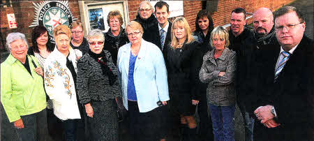 Margaret Tolerton, Edwin Poots, Branda Hale and Jonathon Craig of the DUP pictured with Dunmurry Residents Outside Dunmurry PSNI Station which is due for Closure. US4611-173A0