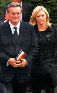 Ballynahinch Baptist Church Pastor Rodney Stout with Emma Rice at the funeral of her father and brothers Noel, Graham and Nevin Spence on Wednesday